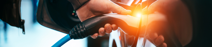Man charging car with electric vehicle charger